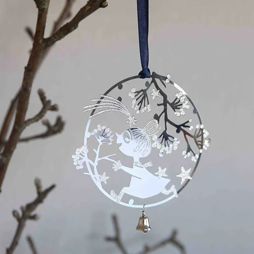 Decorative hanging ornament with a silhouette of Little My and a bell, hanging from a branch.