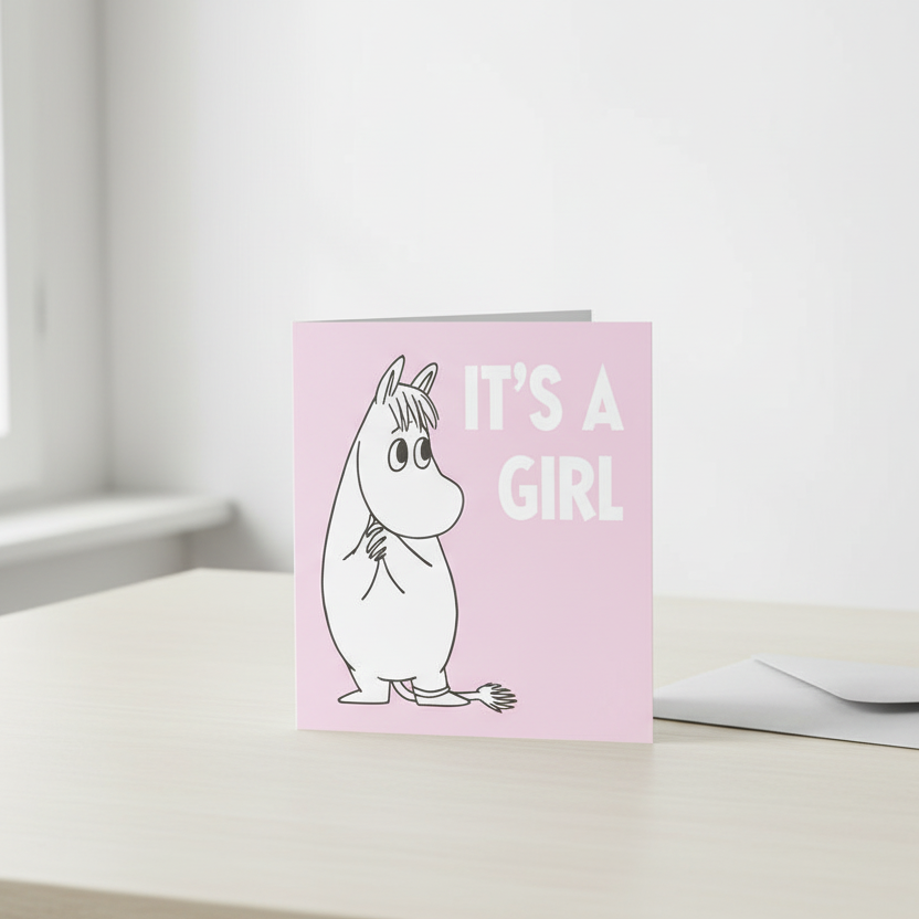 It's a Girl card on desk with envelope